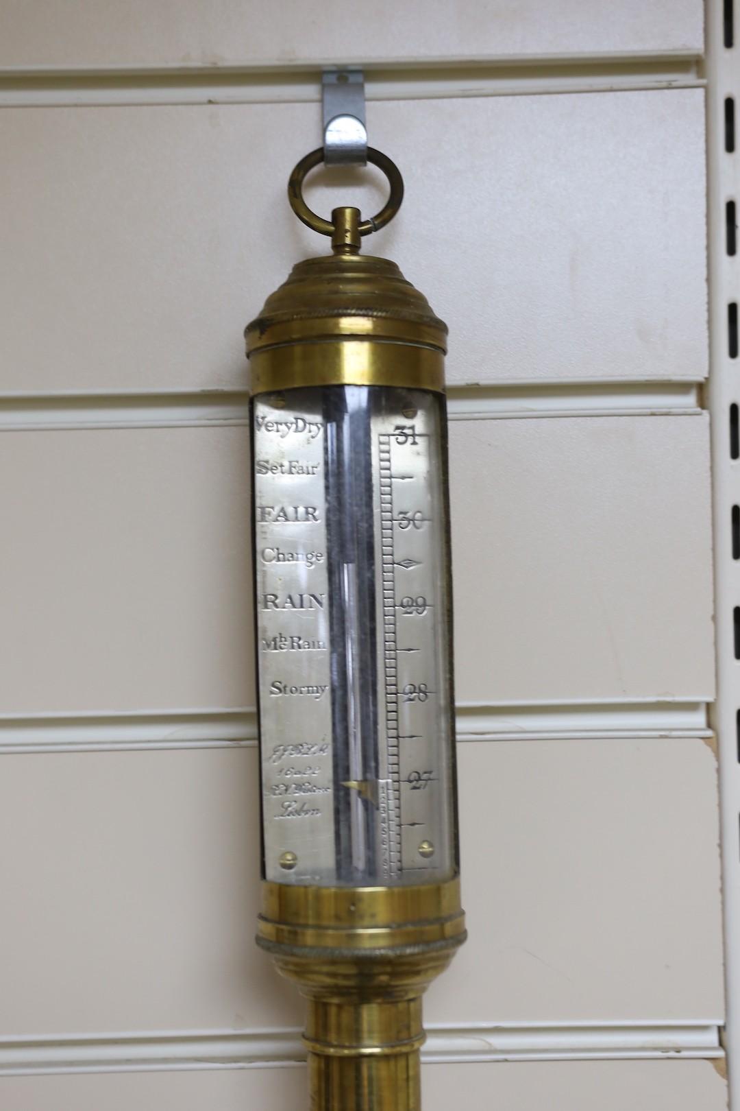 A marine stick barometer and an aneroid barometer, stick barometer 90 cms high.